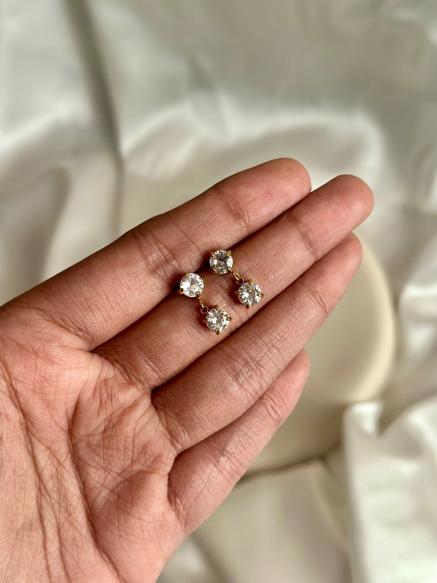 Dainty zircon drops
